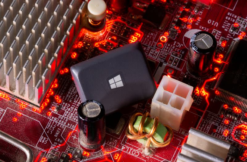 FILE PHOTO: A computer keyboard button with the Microsoft Windows 10 logo is seen on a motherboard in this picture illustration