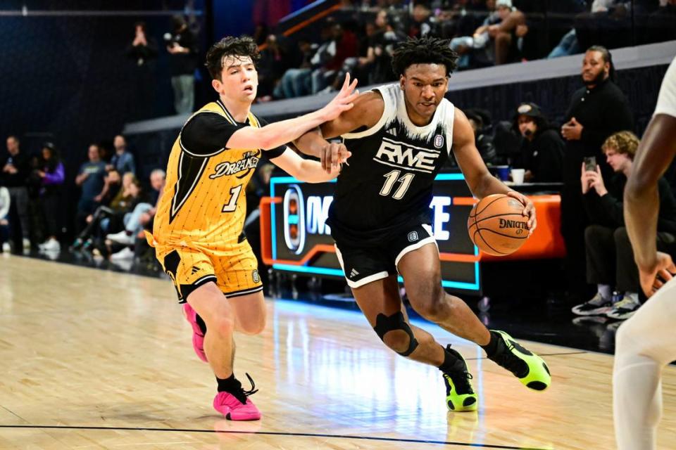 Karter Knox (11) of RWE drives to the basket during an Overtime Elite playoff game on March 1 at OTE Arena in Atlanta. Knox is one of six players committed to Kentucky in the 2024 recruiting class.