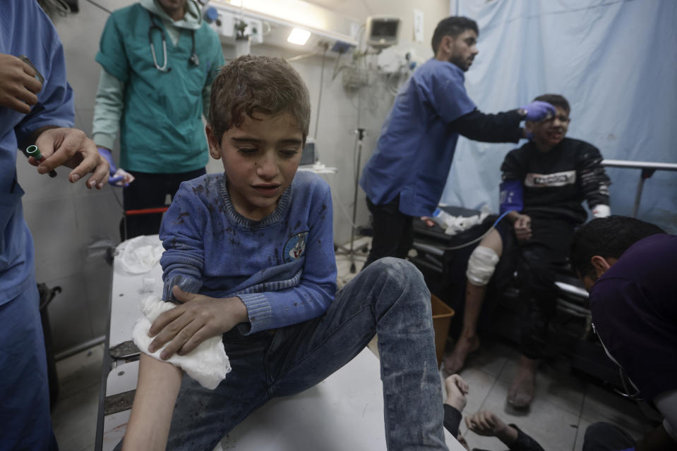 Palestinians wounded in Israeli bombardment, receive treatment at a hospital in Khan Younis refugee camp, southern Gaza Strip, Thursday, Jan. 11, 2024. (AP Photo/Mohammed Dahman)