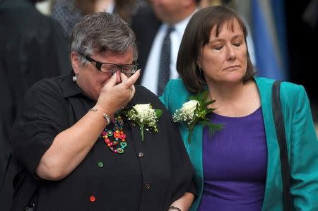 Mourners leave after a service of rememberance for Labour MP Jo Cox who was shot and stabbed to death last week outside her constituency surgery, London, Britain June 20, 2016. REUTERS/Toby Melville