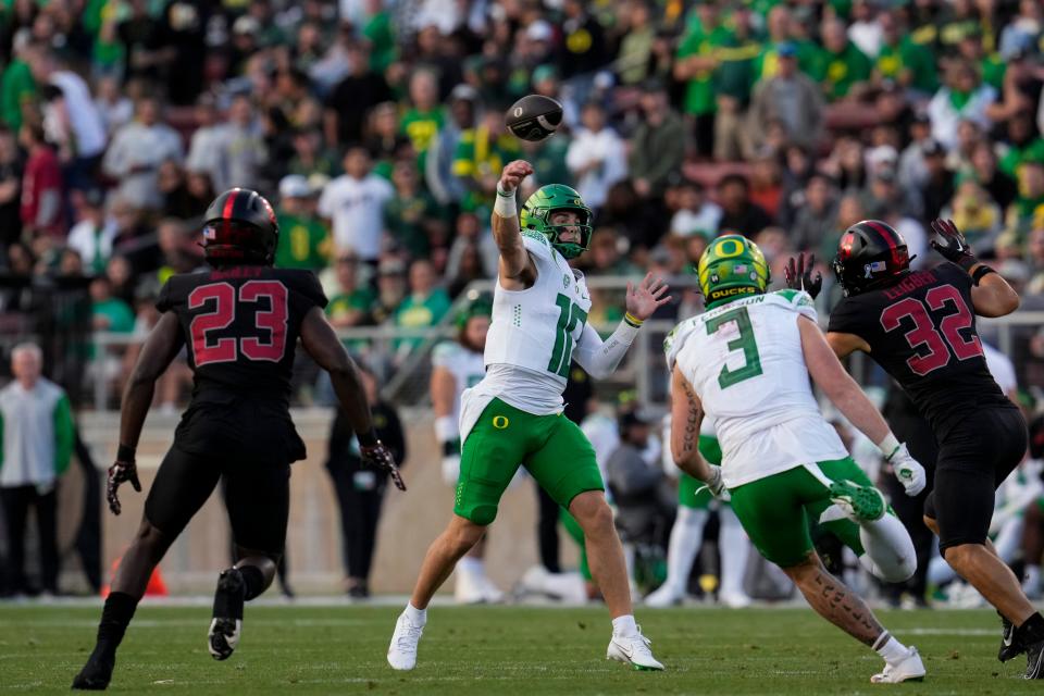 Oregon quarterback Bo Nix, center, throws the ball against Stanford during the second half of the game, Saturday, Sept. 30, 2023, in Stanford, Calif.