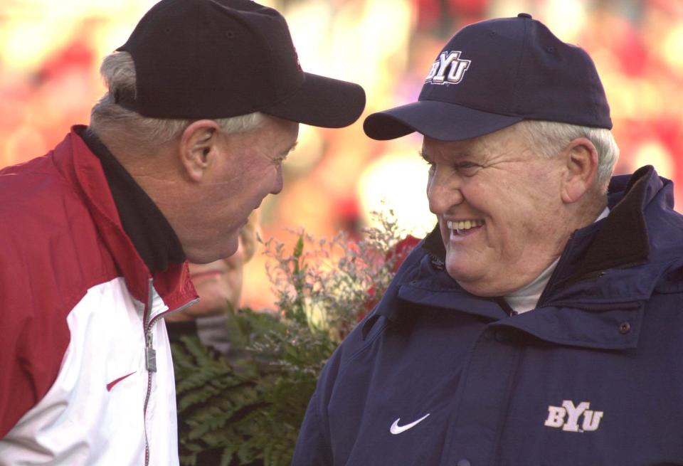 BYU coach LaVell Edwards and Utah coach Ron McBride greet each other before the game at Rice Eccles Stadium at the University of Utah, Friday, November 24, 2000. | Johanna Kirk, Deseret News