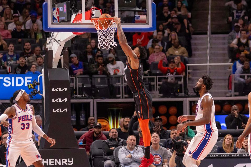 Pistons guard Jared Rhoden slam dunks the ball against the 76ers in the first half on Friday, Nov. 10, 2023, at Little Caesars Arena.
