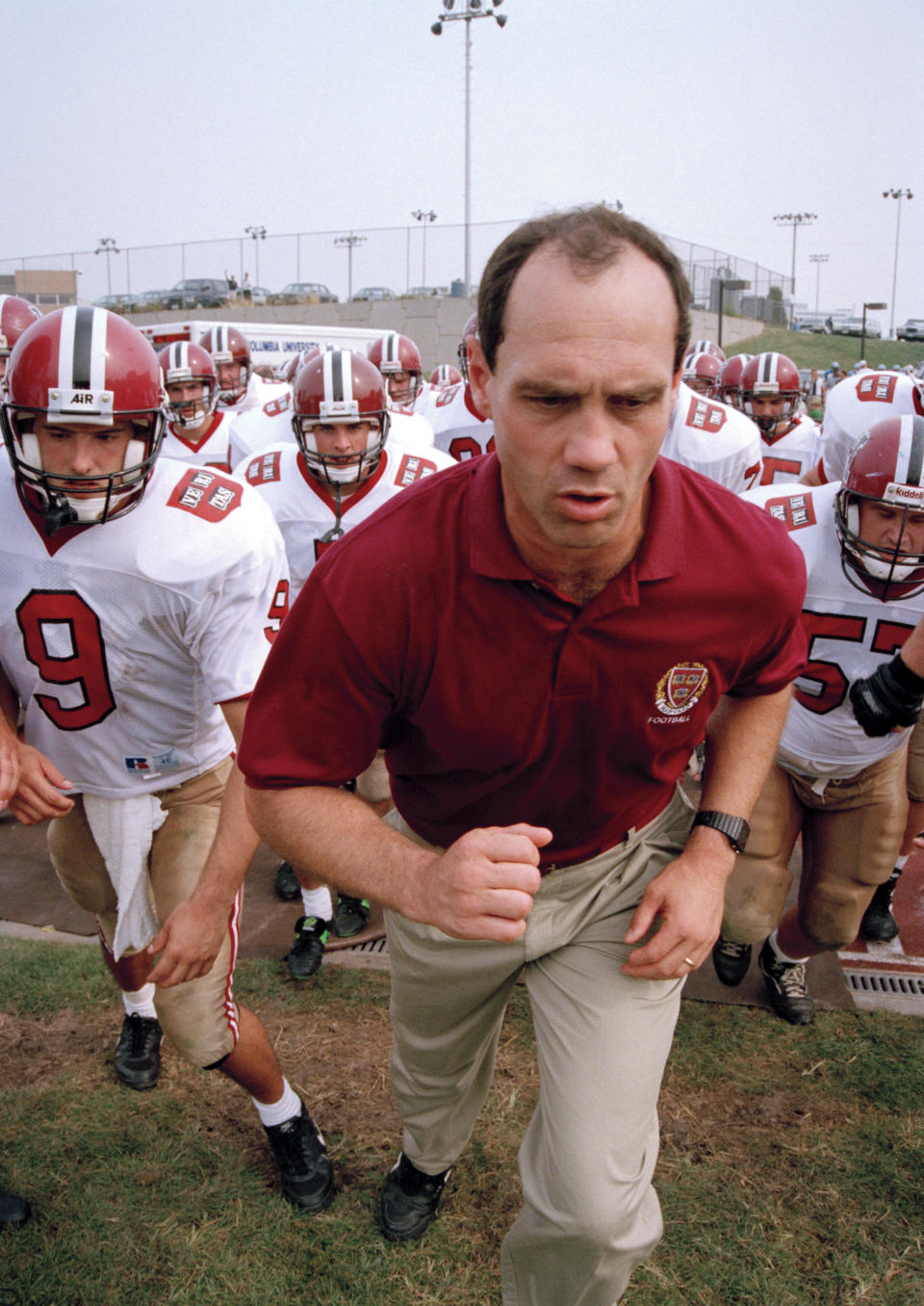 Harvard head coach Tim Murphy leads the Crimson onto Baker Field in New York to face Columbia, Saturday, Sept. 17, 1994. It is the Ivy League opener for Harvard's first year coach. (AP Photo/Eric Miller)