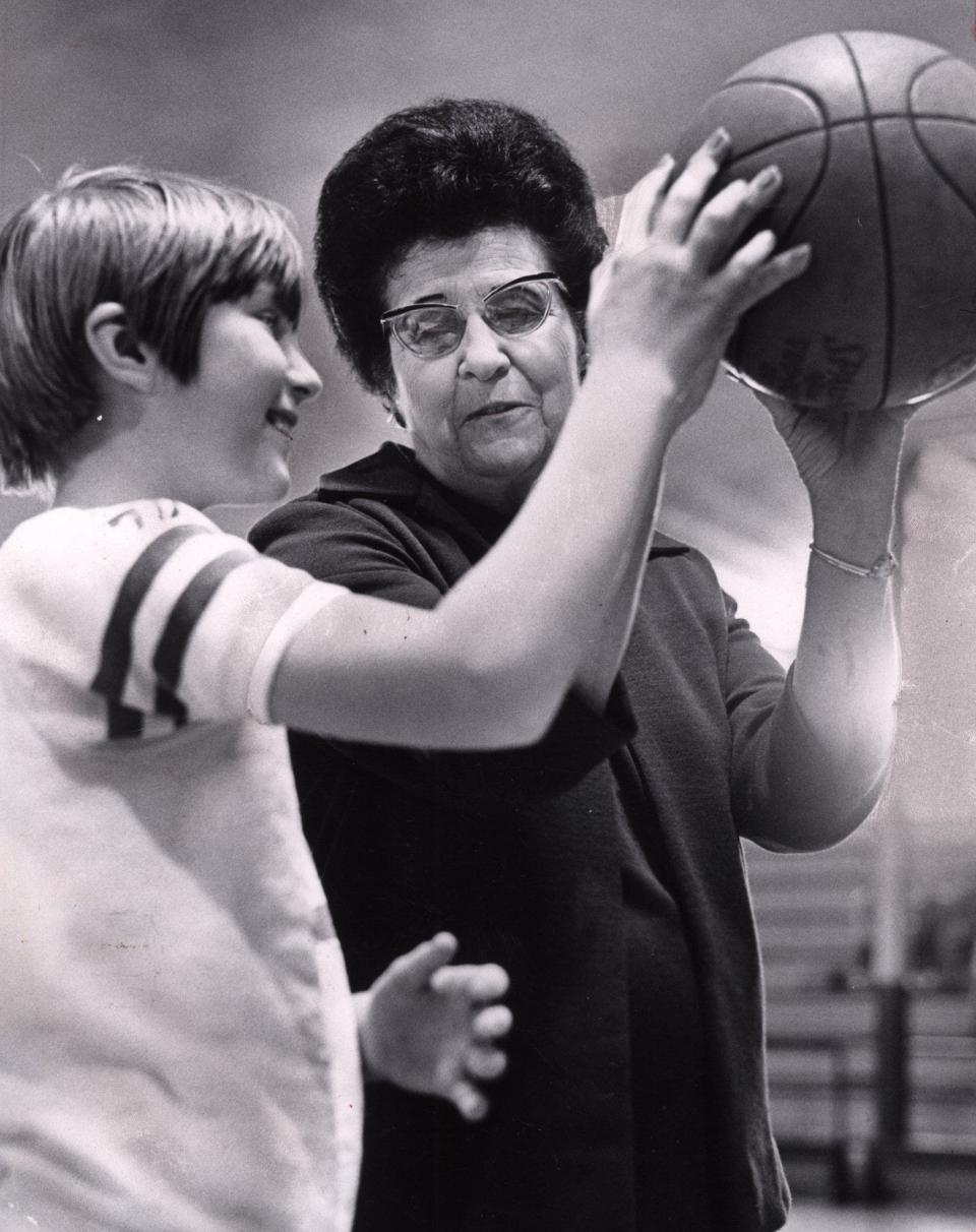 In this 1969 file photo, fifth-grader Cheryl Walker receives instructions from Byng girls basketball coach Bertha Teague.