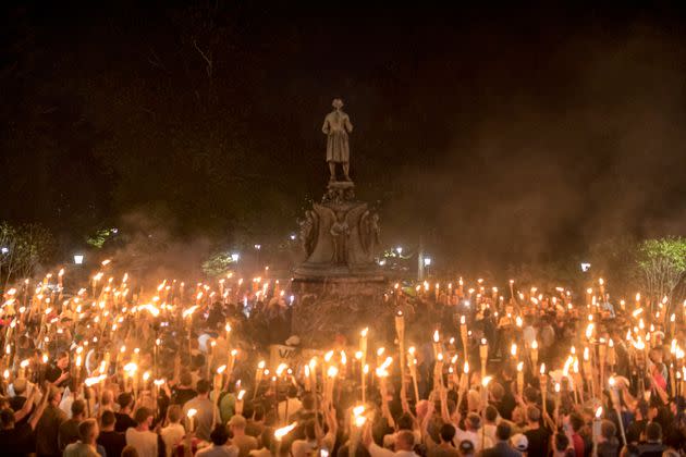 A group of torch-bearing white nationalists rally around a statue of Thomas Jefferson on Aug. 11, 2017, in Charlottesville, Virginia. (Photo: via Associated Press)