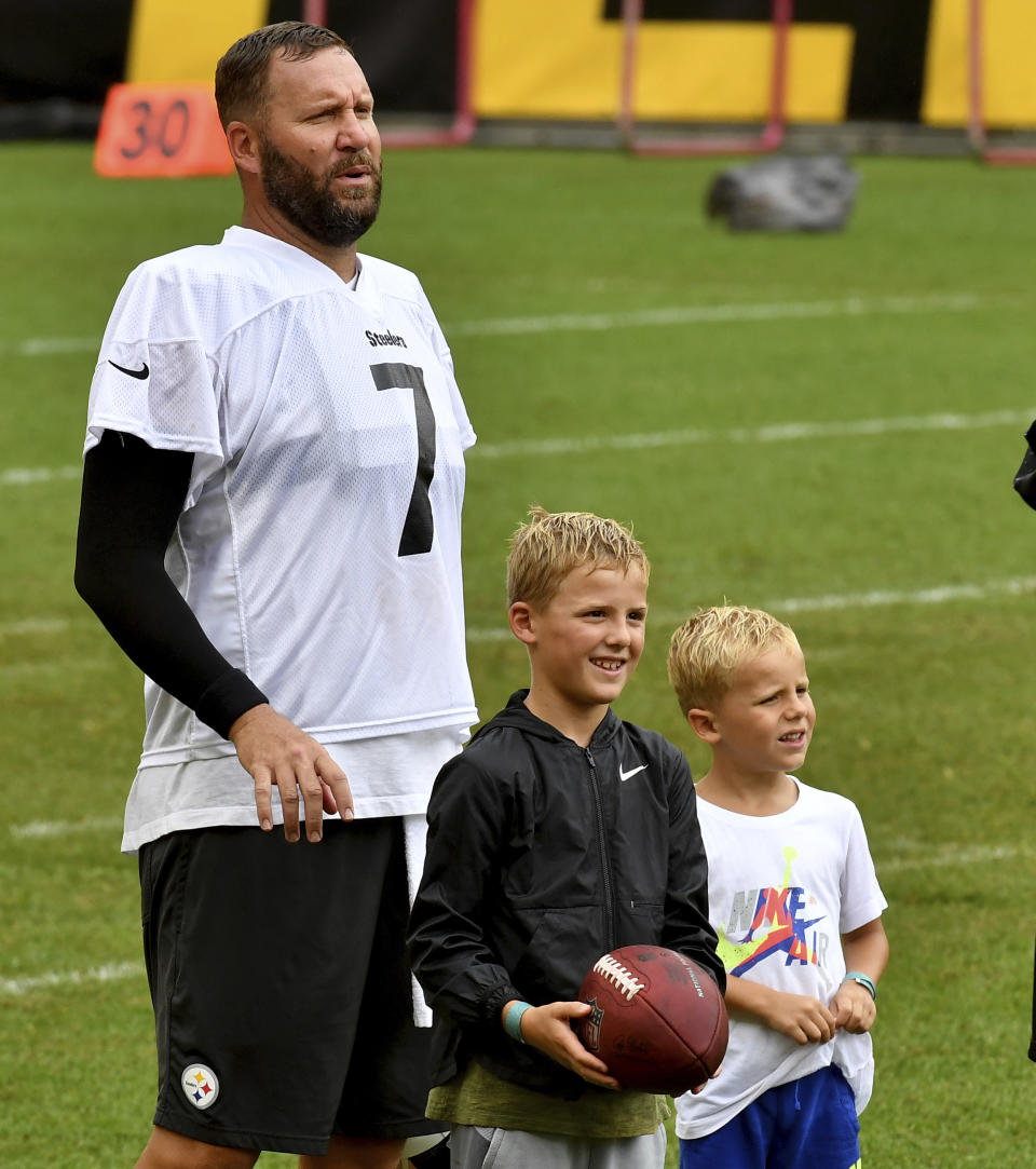 Pittsburgh Steelers quarterback Ben Roethlisberger stands with his children, Ben Jr. and Bodie, during the NFL football team's training camp Wednesday, Aug. 18, 2021, in Pittsburgh. (Matt Freed/Pittsburgh Post-Gazette via AP)