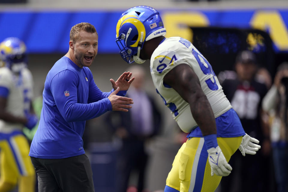 Los Angeles Rams head coach Sean McVay, left, talks with defensive tackle A'Shawn Robinson before an NFL football game against the Atlanta Falcons, Sunday, Sept. 18, 2022, in Inglewood, Calif. (AP Photo/Mark J. Terrill)