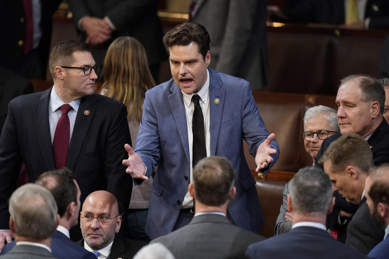 Rep Matt Gaetz, R-Fla., talks with colleagues in the House chamber as the House meets for a second day to elect a speaker and convene the 118th Congress in Washington, Wednesday, Jan. 4, 2023. (AP Photo/Alex Brandon)