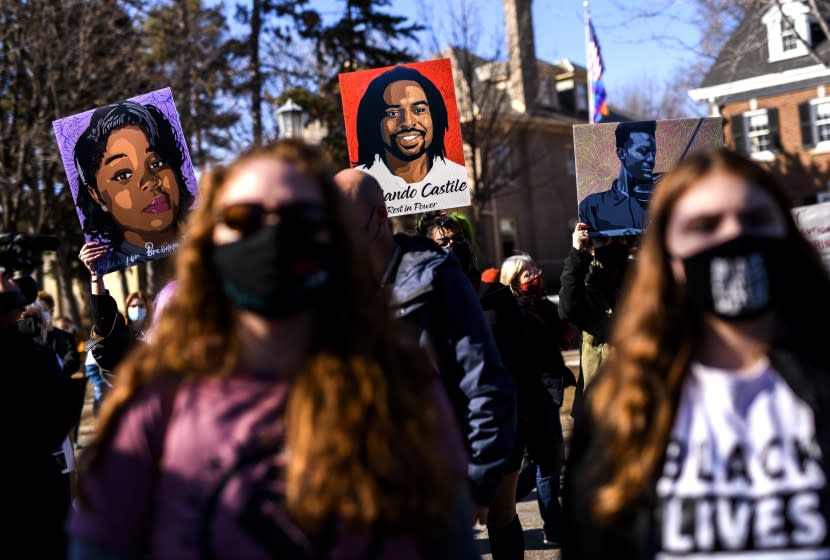 ST. PAUL, MN - MARCH 6: People hold portraits of Breonna Taylor, Philando Castile, and Elijah McClain during a protest demonstration outside the Governors Mansion on March 6, 2021 in St. Paul, Minnesota. A number of protests are scheduled in the days before jury selection is set to begin in the trial of former Minneapolis Police Officer Derek Chauvin on Monday, March 8. (Photo by Stephen Maturen/Getty Images)
