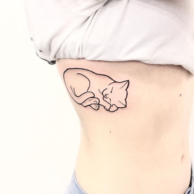 14) Artsy Outline Cat Tattoo