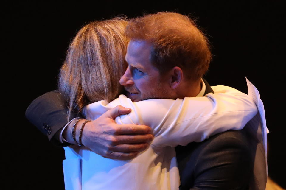 The Duke of Sussex receives a hug as he greets guests at a sustainable tourism summi on Feb. 26, 2020 in Edinburgh, Scotland. (Photo: WPA Pool via Getty Images)