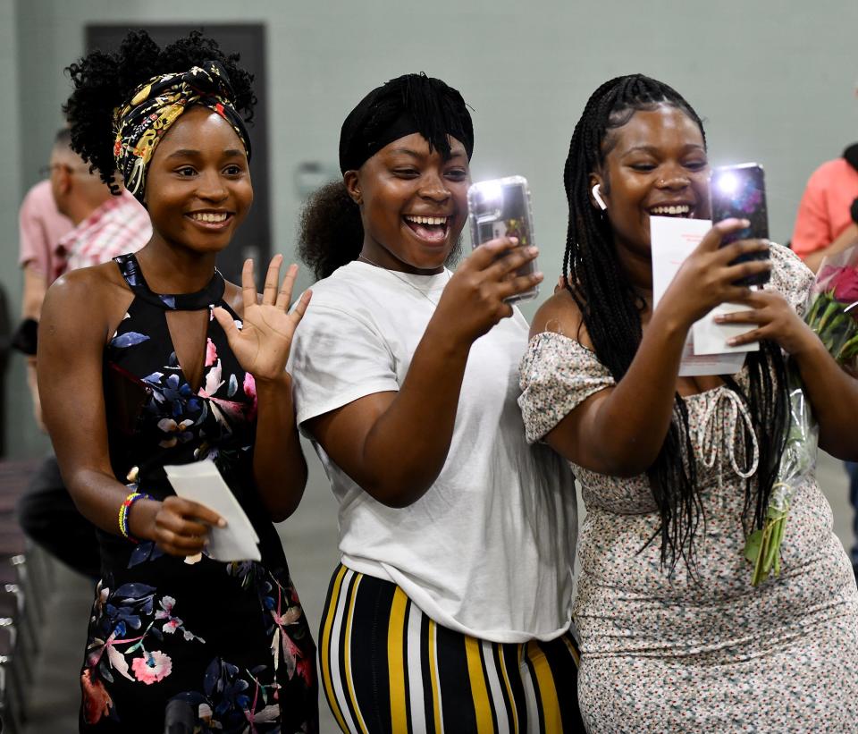 WORCESTER - Family members cheer as graduates proceed to commencement at the DCU Center Wednesday, June 8, 2022.