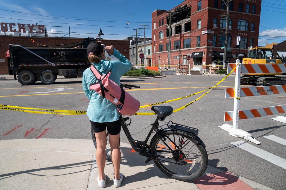 Sandra Segura, 66, of Detroit, looks up at what was once an event space called The Loft at j’adore Detroit Detroit on Sept. 19, 2023, where her daughter's wedding reception took place in December of 2022, which is now open and partially collapsed in an Eastern Market building that occurred Saturday, Sept. 16, 2023. "It's hard to look at we had a major family event there," she said.