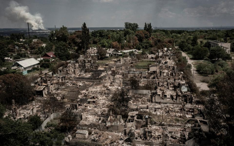 An aerial view shows destroyed houses after strike in the town of Pryvillya at the eastern Ukrainian region of Donbas  - AFP