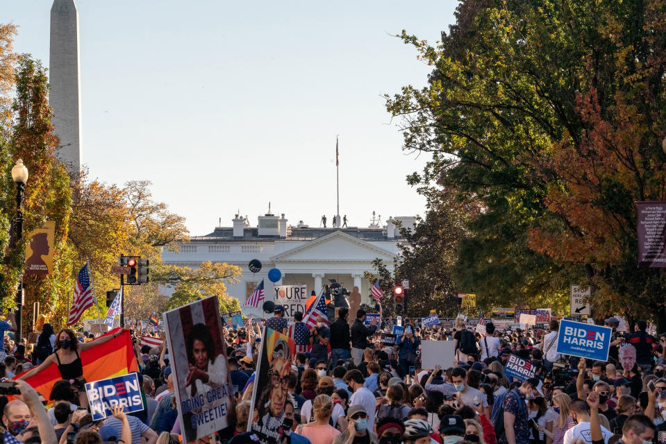 <strong>Washington, D.C., Nov. 7, 2020.</strong> "I was sitting on a curb outside my hotel when I heard cheers. I assumed it was in reaction to a speech at a small protest, and went back to my room. My phone immediately started buzzing with alerts and text messages. Biden had been declared the winner by all the major news networks. I raced down to the White House, where the streets were filling with people. All day and night, the broad avenues were filled with ecstatic crowds — cheering, popping champagne, embracing and weeping."<span class="copyright">Peter van Agtmael—Magnum Photos for TIME</span>