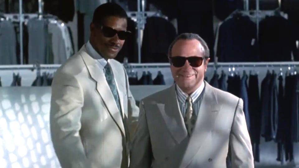 Denzel Washington and Bob Hoskins smiling together during a suit fitting in Heart Condition.