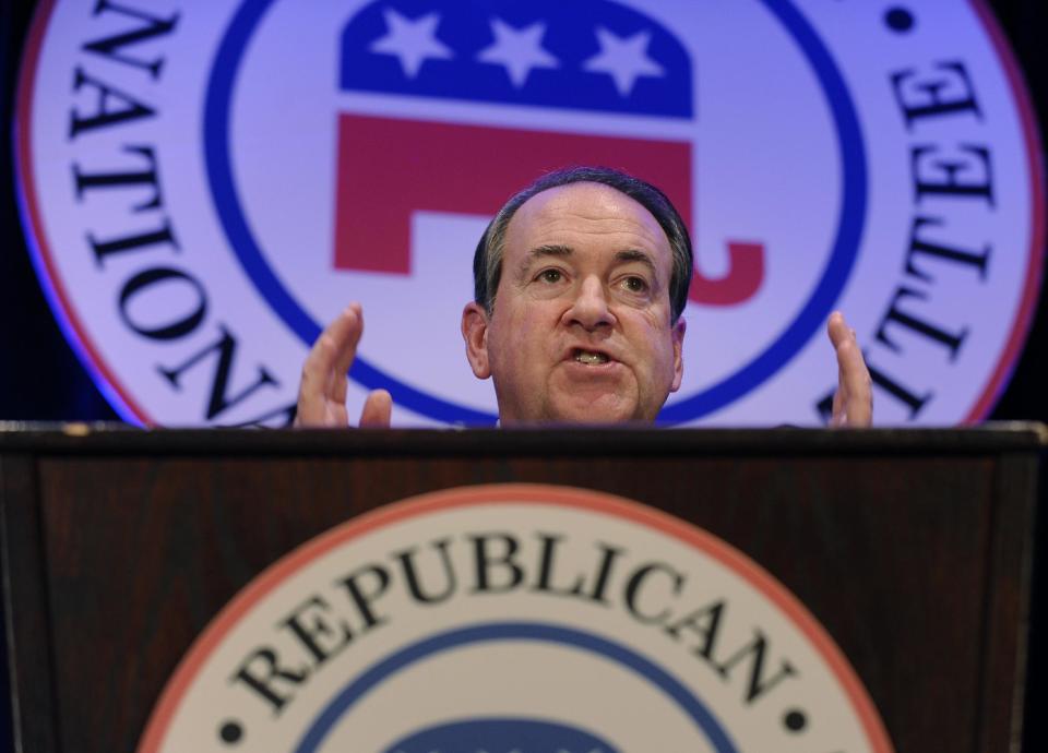 Former Arkansas Gov. Mike Huckabee speaks at the Republican National Committee winter meeting in Washington, Thursday, Jan. 23, 2014. Huckabee isn’t rushing to have his name included among the crowded field of potential Republican presidential candidates. But he isn’t closing the door, either, as he meets Thursday with the GOP’s cardinals at the Republican National Committee. (AP Photo/Susan Walsh)