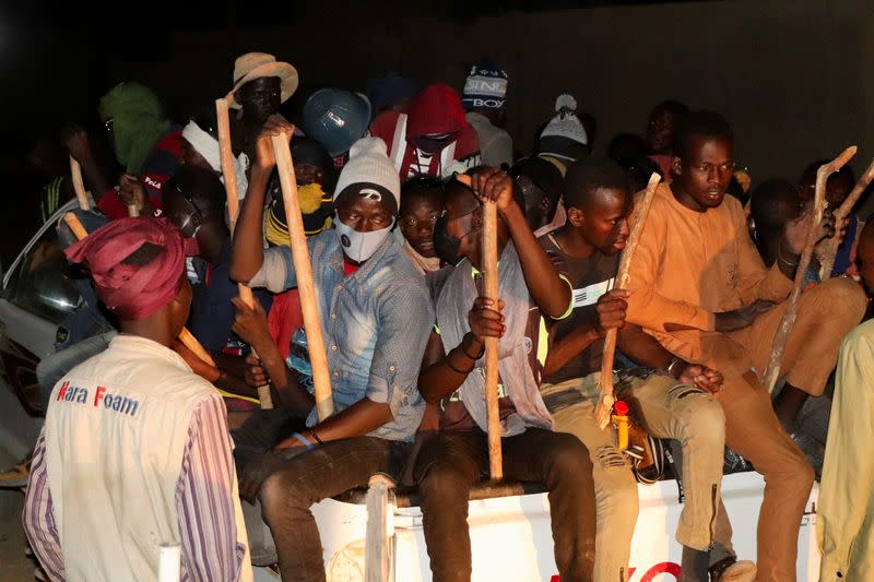 Migrants wait for their departure to Libya in Agadez