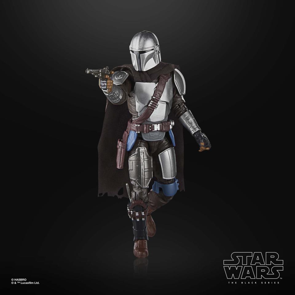 The Mandalorian action figure posed against a black background