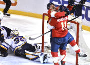 Florida Panthers center Sam Reinhart celebrates a goal against the St. Louis Blues with teammate left wing Jonathan Huberdeau (11) during the second period of an NHL hockey game Saturday, Dec. 4, 2021, in Sunrise, Fla. (AP Photo/Jim Rassol)