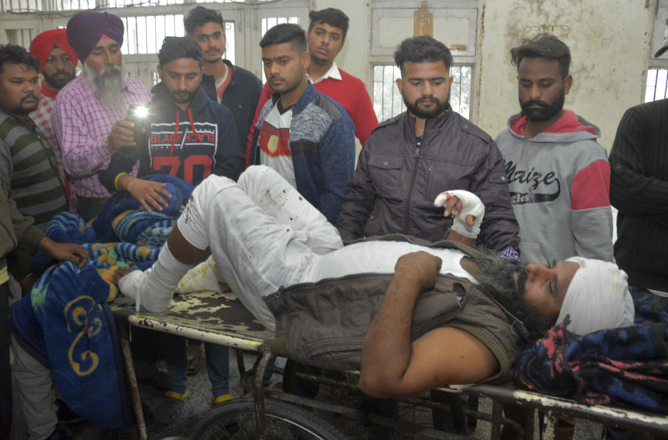 A man injured in a blast at Nirankari Bhawan, a prayer hall in nearby Adliwal village receives treatment at a hospital in Amritsar, India, Sunday, Nov.18, 2018. Three people were killed and over a dozen injured on Sunday when two men on a motorbike targeted the prayer hall with a grenade police said. (AP Photo/Prabhjot Gill)