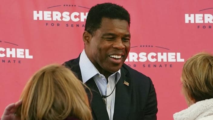 Herschel Walker, Republican candidate for U.S. Senate in Georgia, greets supporters during an Oct. 18 campaign rally in Atlanta. (Photo: John Bazemore/AP, File)