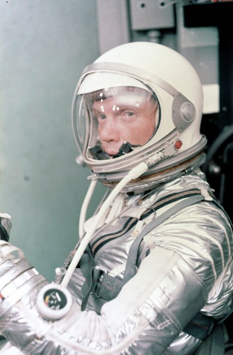 Astronaut John H. Glenn Jr. dons his silver Mercury pressure suit in preparation for launch. On Feb. 20, 1962, Glenn lifted off into space aboard his Mercury Atlas (MA-6) rocket and became the first American to orbit the Earth. After orbiting the Earth 3 times, Friendship 7 landed in the Atlantic Ocean 4 hours, 55 minutes and 23 seconds later. (NASA)