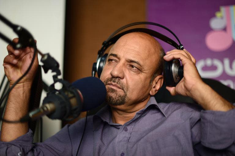 Radio presenter Humayun Danishyar, co-host of the "Safai Shahar" (Cleaning the City) radio show in Afghanistan on June 10, 2014