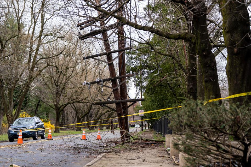 Apr 4, 2024; Tenafly, N.J., United States; A broken utility pole on Dean Drive is shown after a storm.