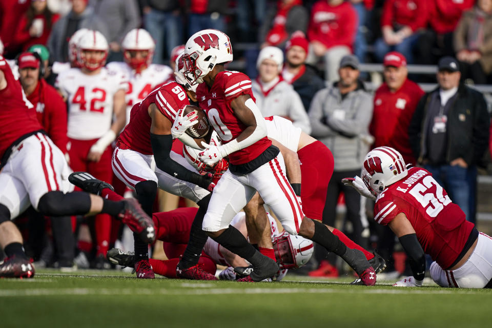 Wisconsin wide receiver Stephan Bracey (10) returns a kickoff for a touchdown against Nebraska during the first half of an NCAA college football game Saturday, Nov. 20, 2021, in Madison, Wis. (AP Photo/Andy Manis)