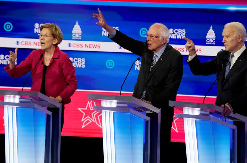 FILE PHOTO: Candidates discuss an issue during the tenth Democratic 2020 presidential debate at the Gaillard Center in Charleston, South Carolina, U.S.