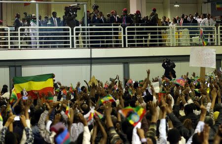 Eritrea's President Isaias Afwerki and Ethiopian Prime Minister Abiy Ahmed look at supporters as they attend a concert at the Millennium Hall in Addis Ababa, Ethiopia July 15, 2018. REUTERS/Tiksa Negeri