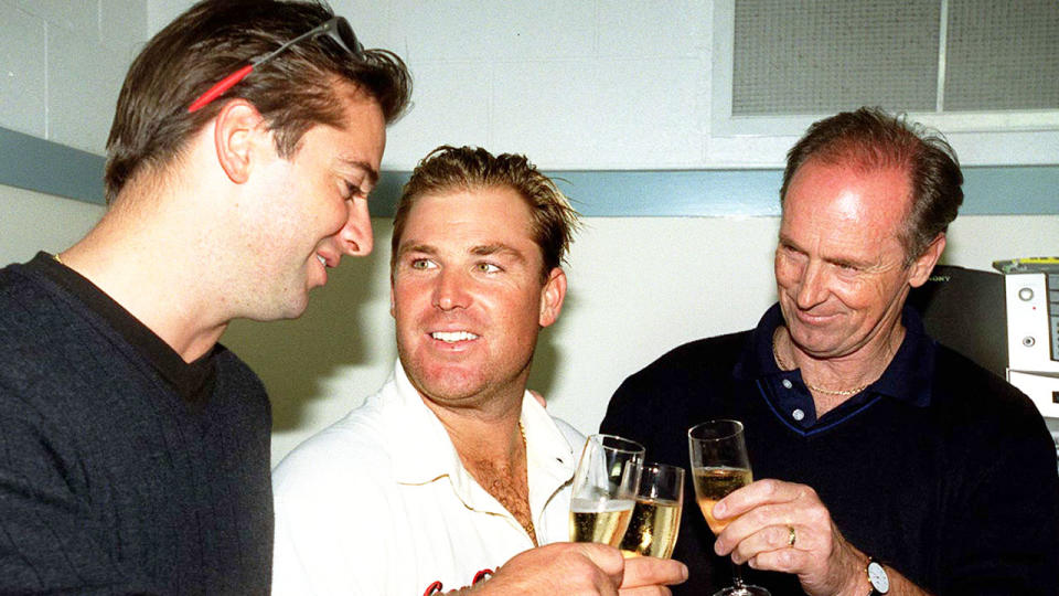 Jason Warne is pictured left with brother Shane after a Test win for the Australian cricket team.