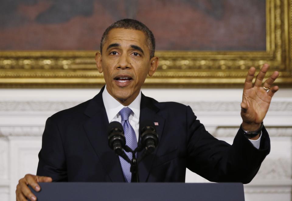 U.S. President Barack Obama delivers remarks on the end of the U.S. government shutdown in the State Dining Room of the White House in Washington, October 17, 2013. The U.S. Congress on Wednesday approved an 11th-hour deal to end a partial government shutdown and pull the world's biggest economy back from the brink of a historic debt default that could have threatened financial calamity. REUTERS/Jason Reed (UNITED STATES - Tags: POLITICS BUSINESS EMPLOYMENT)