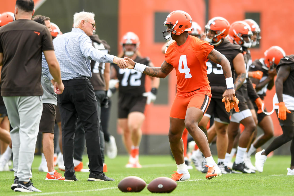 BEREA, OH - MAY 25: Deshaun Watson #4 of the Cleveland Browns shakes hands with managing and principal partner Jimmy Haslam during the Cleveland Browns OTAs at CrossCountry Mortgage Campus on May 25, 2022 in Berea, Ohio. (Photo by Nick Cammett/Diamond Images via Getty Images)