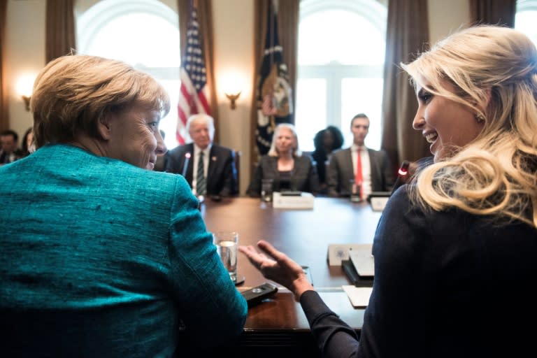 Germany's Chancellor Angela Merkel (L) and Ivanka Trump (R) talk before a meeting with US President Donald Trump and business leaders in the White House