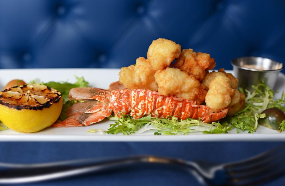 Tempura-fried lobster tail with roasted shallot and charred lemon aioli is on the menu at Okeechobee Prime Seafood in West Palm Beach. ALISSA DRAGUN