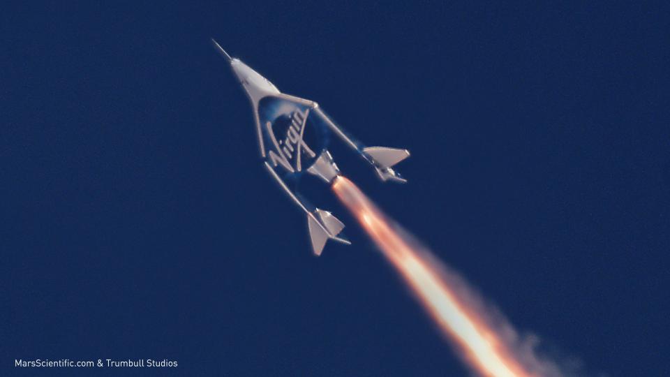 A Virgin Galactic spaceship boosting into the sky