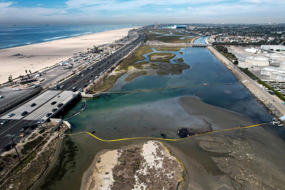 Floating barriers known as booms were in place Oct. 4 to try to protect the Talbert Marsh wetlands after an oil spill off Huntington Beach, California.