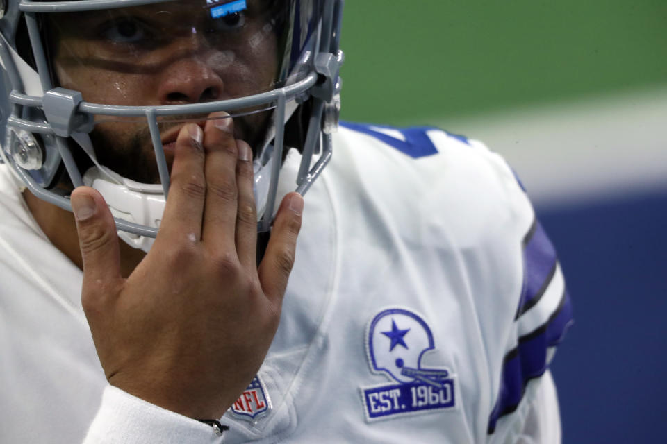 A close-up on Dak Prescott and a Cowboys patch on his shoulder. 