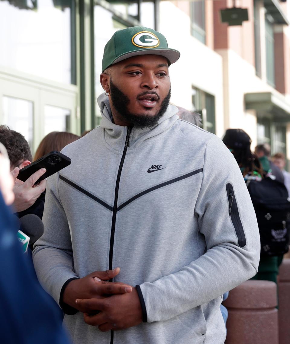 Green Bay Packers guard Elgton Jenkins speaks to the media Tuesday outside Lambeau Field before the start of the team's annual Tailgate Tour.