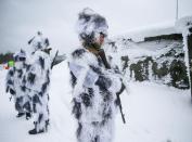 Ukrainian service members are seen during drills with NLAW missiles in the Lviv region