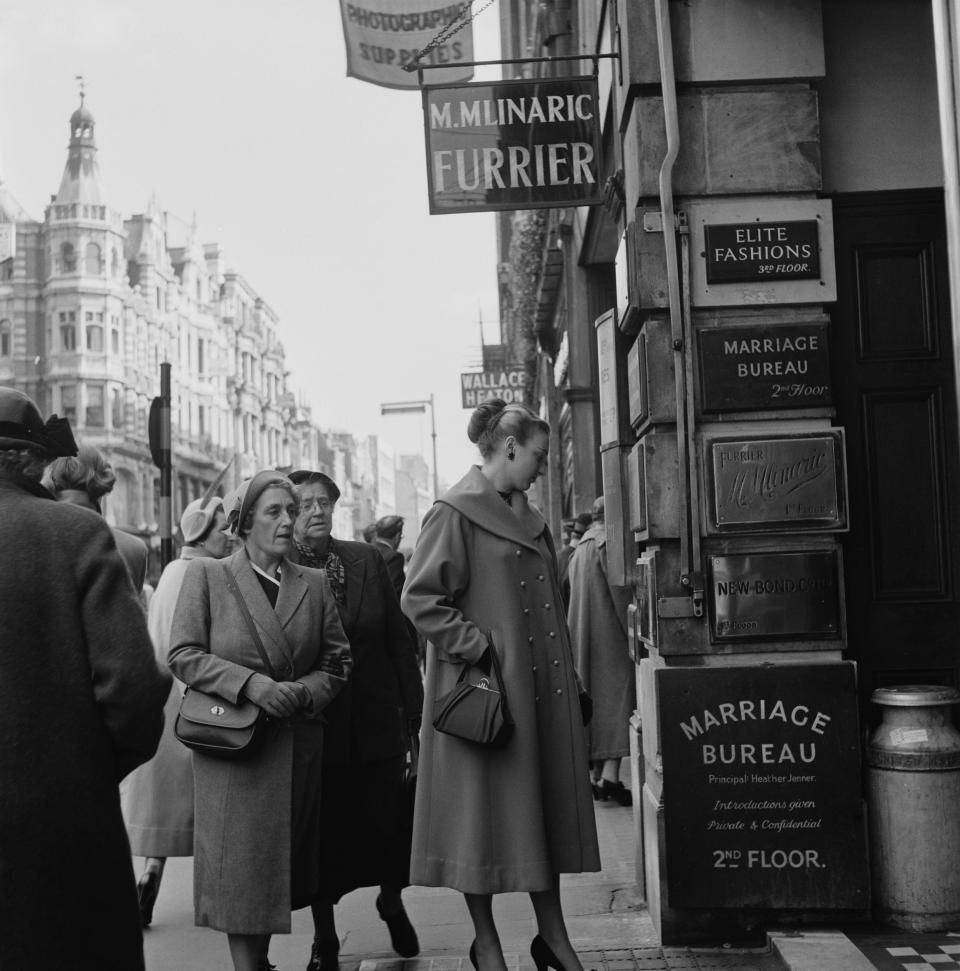 People were back on the streets in London later in December 1952.