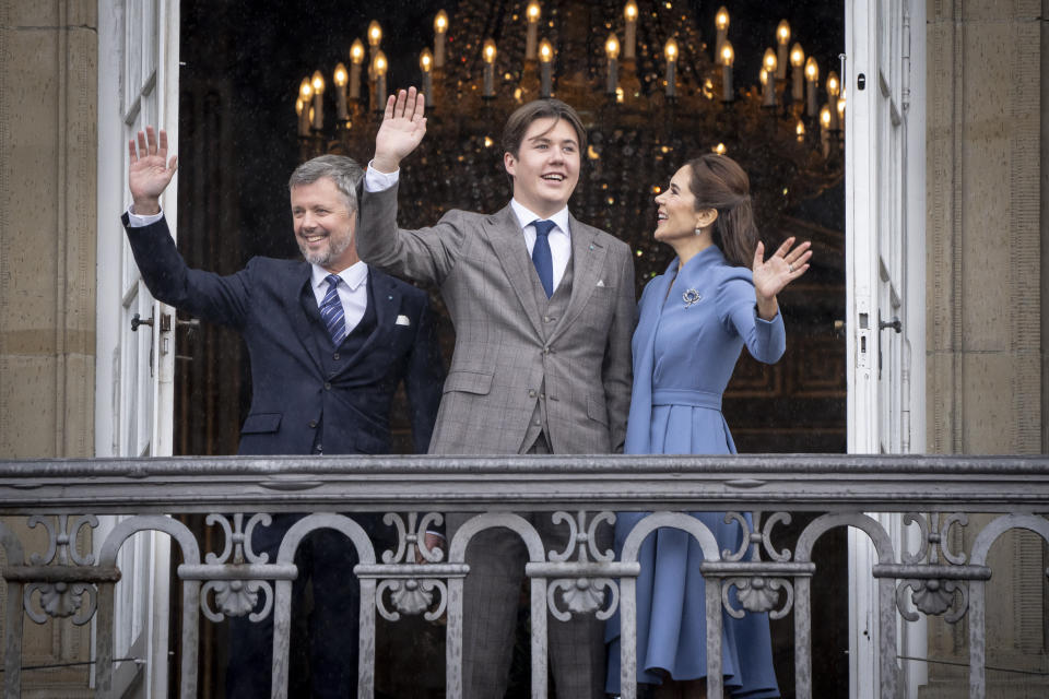 FILE - From left, Denmark's Crown Prince Frederik, Prince Christian and Crown Princess Mary wave on Christian's 18th birthday, at Frederik VIII's Palace, Amalienborg Castle, in Copenhagen, Sunday, Oct. 15, 2023. Queen Margrethe II, Denmark’s monarch for more than half a century, stunned her country when she announced on New Year’s Eve that she will hand over the throne to her eldest son, Crown Prince Frederik, on Jan. 14, 2024. It’s the first time a Danish monarch has stepped down voluntarily in nearly 900 years. (Mads Claus Rasmussen/Ritzau Scanpix via AP, File)