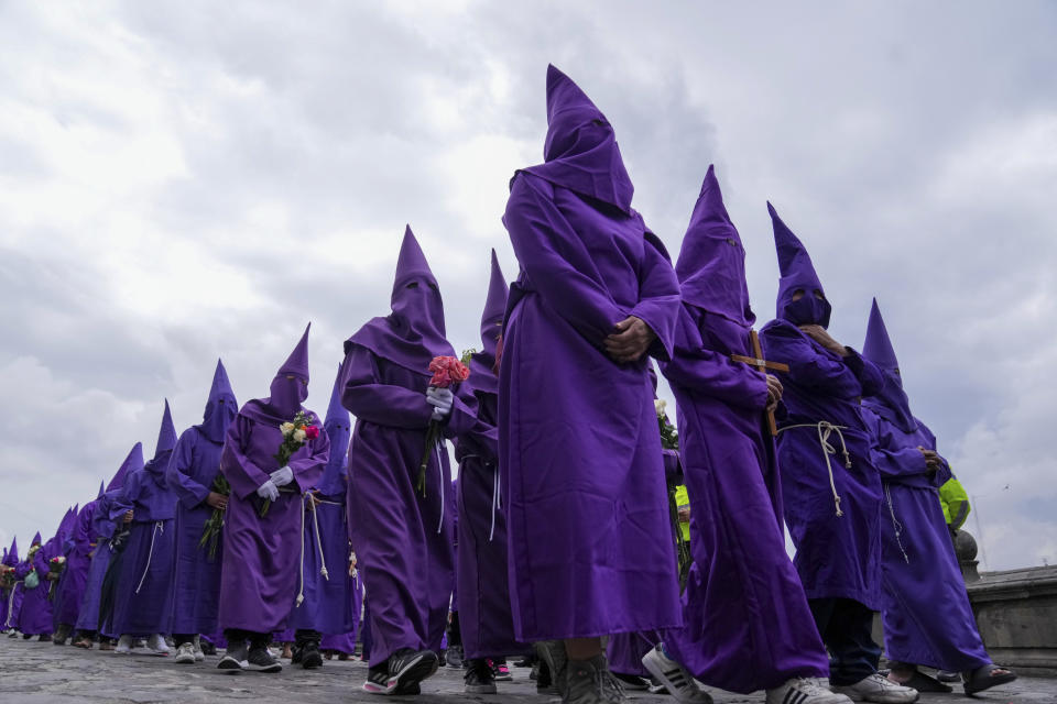 Penitents known as cucuruchos file past in the Jesus the Almighty Good Friday procession, as part of Holy Week celebrations, in Quito, Ecuador, Friday, March 29, 2024. Holy Week commemorates the last week of Jesus Christ’s earthly life which culminates with his crucifixion on Good Friday and his resurrection on Easter Sunday. (AP Photo/Dolores Ochoa)