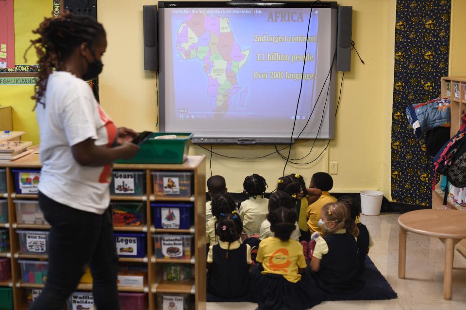 Children watch a presentation at the Little Sun People preschool.