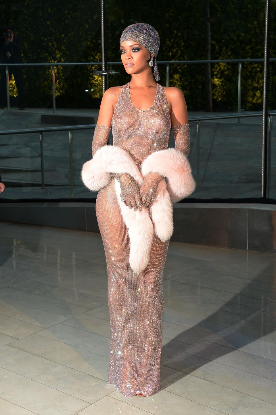 Rihanna with her “nips out” wearing Adam Selman to the CFDA Fashion Awards on June 2, 2014.