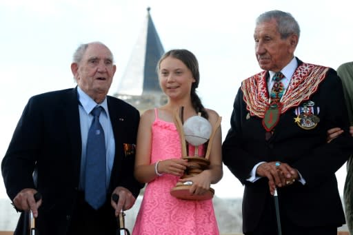 WWII veterans Charles Norman Shay and Leon Gautier flanked Thunberg at Sunday's ceremony