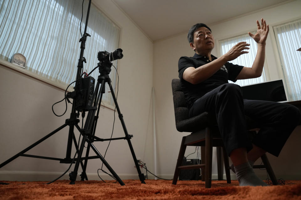 Wang Zhi'an speaks during an interview with the Associated Press in Tokyo on Oct. 5, 2022. Chinese investigative journalist Wang once exposed corruption, land seizures, and medical malpractice for state broadcaster CCTV. Today, he's in exile in Japan, and starting again as an independent journalist on YouTube. (AP Photo/Eugene Hoshiko)